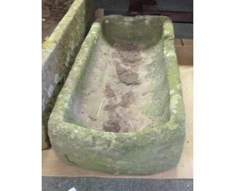 A narrow stone trough with D end, 80cm x 36cm