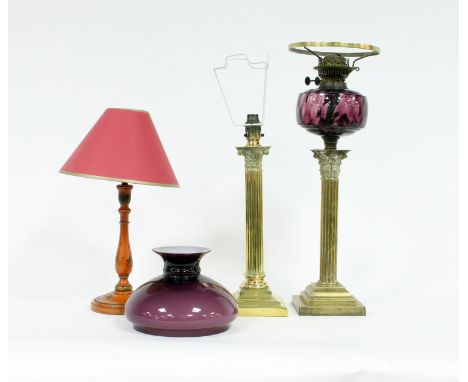 An oil lamp with purple shade, amethyst glass reservoir and set on glass column support, a brass lamp of Corinthian column fo
