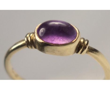 9 CT GOLD OVAL AMETHYST CABOCHON RING, SIZE P 1/2, GROSS WEIGHT 1.6 GRAMS 