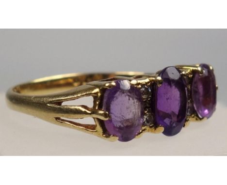 YELLOW METAL DRESS RING STAMPED 18 CT, AMETHYST AND DIAMOND, SIZE N 1/2, SET SEVEN STONES, GROSS WEIGHT 3.2 GRAMS 