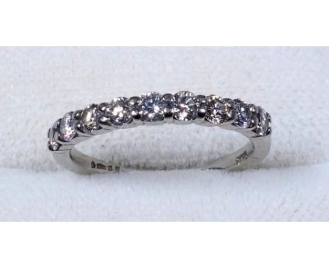 PLATINUM WEDDING RING, SIZE K, AND A PLATINUM HALF-ETERNITY RING, SIZE G 1/2, SET NINE DIAMONDS, GROSS WEIGHT 6.2 GRAMS (2) 