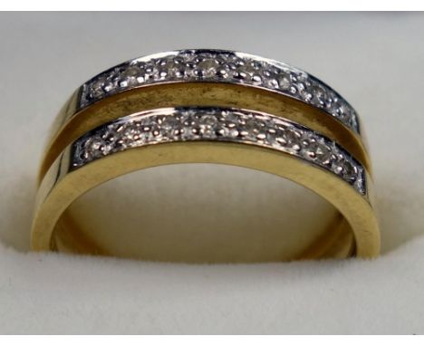 YELLOW METAL DOUBLE BAND AND ILLUSION SET DIAMOND RING, STAMPED 18 K AND 750, SIZE N 1/2, GROSS WEIGHT 4.1 GRAMS 