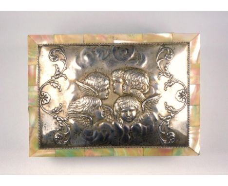 EDWARDIAN MOTHER OF PEARL AND SILVER MOUNTED RECTANGULAR JEWEL BOX, THE HINGED COVER EMBOSSED WITH FIVE CHERUB MASKS BY JAMES