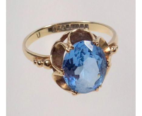 9 CT GOLD RING, SIZE L 1/2, SET OVAL CUT BLUE TINTED STONE, 2.5 GRAMS 