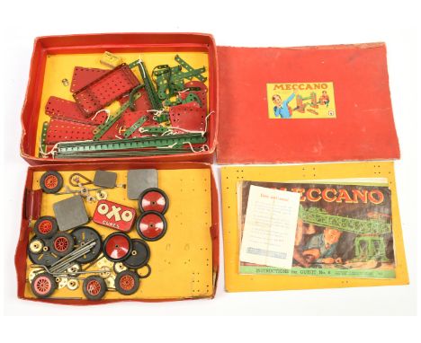 Meccano Outfit No.6 - Has instruction manual combined with a group of Green and Red components. Lid is missing sides. Conditi