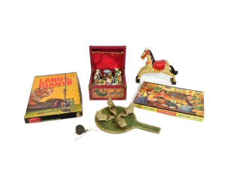 A collection of vintage childrens toys and games comprising a Christmas music box, wooden horse, pecking chickens on a wooden