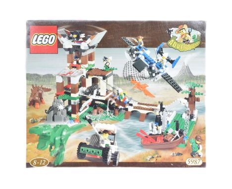 Lego - a collection of Lego Adventure theme sets comprising; 5987 Dino Research Compound, 5911 Johnny Thunder's Plane, 5912 H