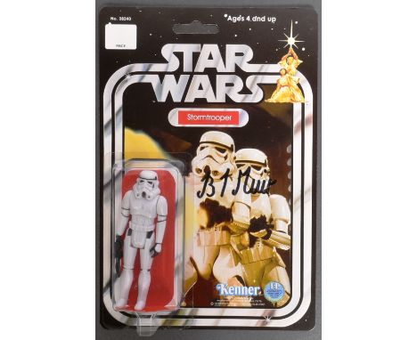 Star Wars - Brian Muir (Sculptor) - a recarded vintage style action figure of a Stormtrooper, the card signed by Muir in blac