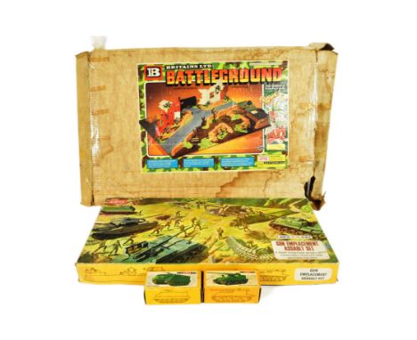 An original vintage Britains Battleground set (base only) and and Airfix OO gauge / 1/76 scale Gun Emplacement Assault set. A