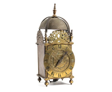 A BRASS BALANCE WHEEL STRIKING LANTERN CLOCKMid 17th Century and laterOf usual form with large bell, four straps and turned f