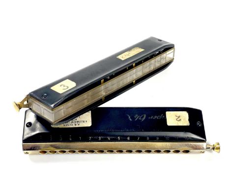 Two cased 'Hohner' Super 64X 16 hole chromatic harmonicas. Black with a (worn) gold finish. (2)