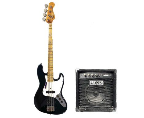 A 1974/75 Fender Jazz bass guitar. Finish: Black, S/N 5XXXX6, includes a vintage Fender tweed case and a Fender Rumble 15 bas