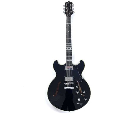 An Aslin Dane Jazz 35 electric guitar. Finish: Black, made in Korea, includes a hard case.