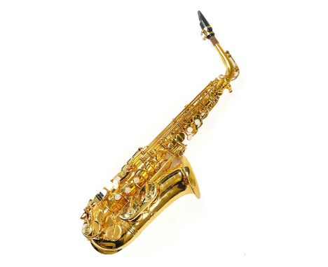 A cased 'Da Vinci' Alto Saxophone. Includes a music stand, an instrument stand, and a selection of music books. (2)There appe