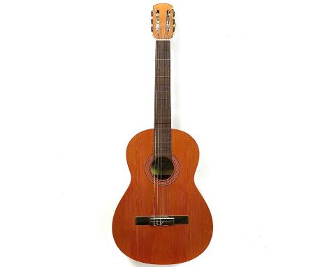 A 'Raimundo' 104 classical guitar. Made in Spain.This guitar comes without a case.