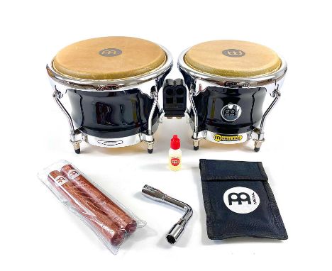 A pair of 'Meinl' free ride series wooden ebony bongos in near mint condition. With chrome plated hardware and tuning key; Wi