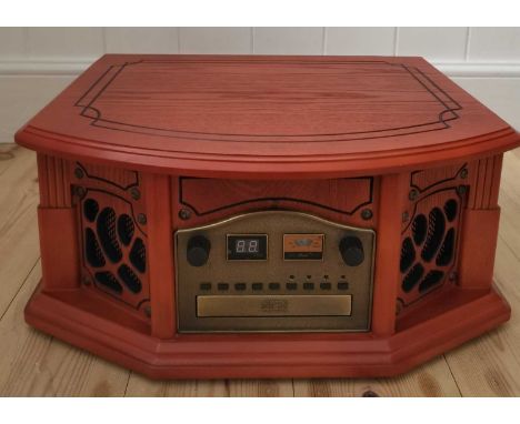 A retro style music centre. A radio, record, and CD player. New and unused with original packaging.(This lot has not been PAT