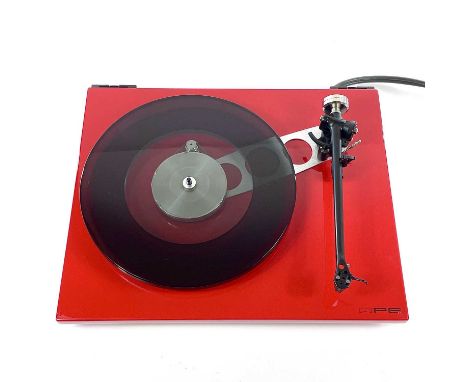 A stylish red Rega RP6 turntable. With external power supply, repair needed to speaker pin. (2)The cartridge and stylus appea