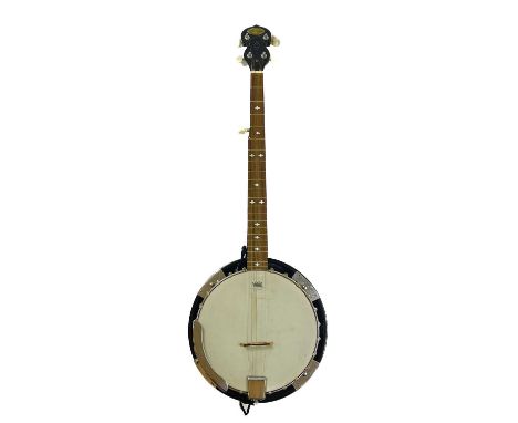 A Stagg banjo. A five string closed back resonator banjo.