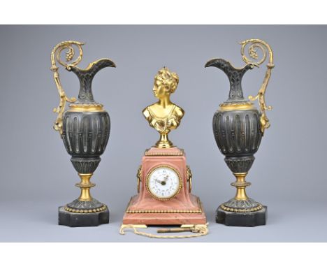 MANTLE CLOCK WITH FEMALE BUST FINIAL, yellow metal details and key; together with pair of slate and ormolu mantle urns, urn h