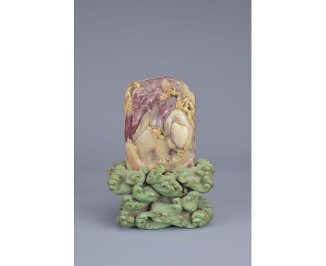 A CHINESE CARVED SOAPSTONE SEAL ON STAND, 19TH CENTURY. Of rectangular form carved in relief with figures in a boat below mou