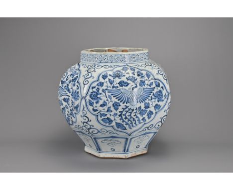 A VINTAGE CHINESE BLUE AND WHITE PORCELAIN JAR. Octagonal shaped jar decorated in the Yuan dynasty style with phoenix and flo