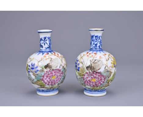 A PAIR OF CHINESE MINIATURE PORCELAIN VASES, REPUBLIC PERIOD. Each decorated in underglaze blue and famille rose enamels of i