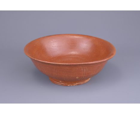 A BURMESE CERAMIC BOWL, PROBABLY 15TH CENTURY. With rounded body and everted rim&nbsp;with lappet decoration to the exterior 