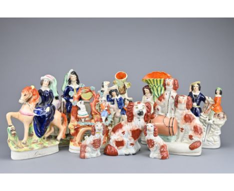 TEN VICTORIAN STAFFORDSHIRE ITEMS to include: three seated spaniels with gilt collars; figure group of musician and dancer on
