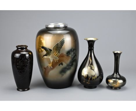 FOUR VINTAGE JAPANESE METALWARE VASES, 20TH CENTURY. Of various forms decorated with dragons, cranes, eagle and landscape sce