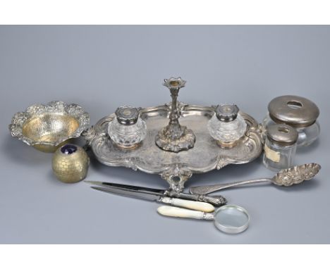 A GROUP OF SILVER / SILVER PLATED ITEMS. To include a ink well tray with candlestick, a decorative serving spoon, two letter 