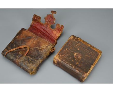AN ANTIQUE LEATHER CASED QURAN MANUSCRIPT, PROBABLY 19TH CENTURY. Paper with handwritten script in a leather pouch. Approx. 1
