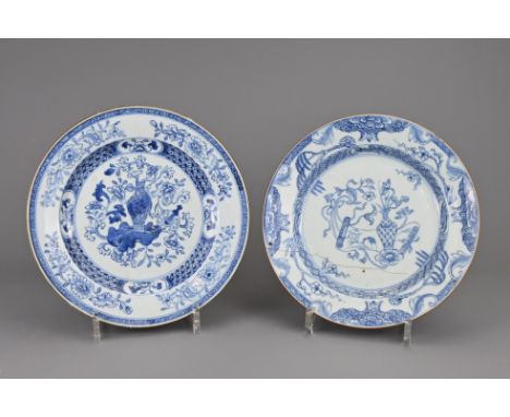 TWO CHINESE BLUE AND WHITE PORCELAIN DISHES, 18TH CENTURY. Decorated with scroll and floral scenes. 22.5cm and 23cm diam. (2)