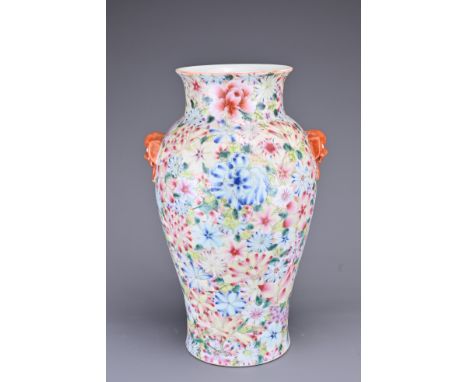 A CHINESE MILLE FLEUR PORCELAIN VASE, EARLY 20TH CENTURY. With animal mask ring handles in iron-red. Six-character seal mark 