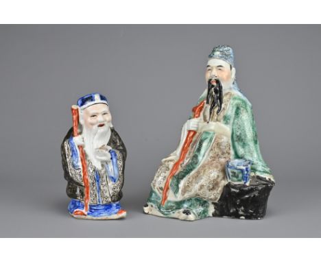 TWO CHINESE PAINTED PORCELAIN FIGURES, REPUBLIC PERIOD, EARLY 20TH CENTURY. One figure of Shou Lao, God of longevity, seated 