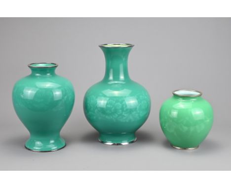 THREE VINTAGE JAPANESE ANDO ENAMEL VASES, 20TH CENTURY. Each of various shapes covered in a green enamel with floral decorati
