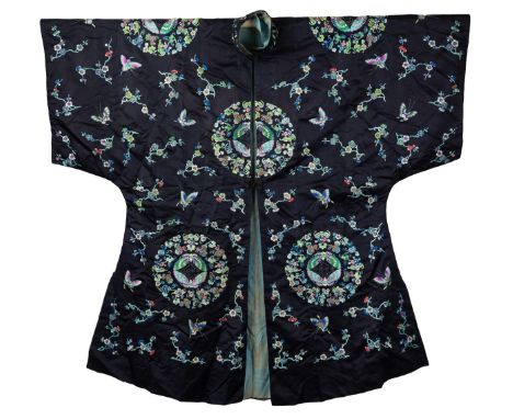 A CHINESE SILK EMBROIDERED WOMEN'S SURCOAT ROBE, LATE QING DYNASTY. Finely embroidered with vibrant coloured silk on black gr