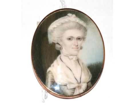 English School (late 18th century)  Portrait of a lady, with backswept powdered hair, lace cap and white fichu Oval, 4cm