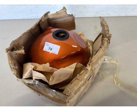 Orange painted backing for a headlamp for an Yamaha R5 motorcycle