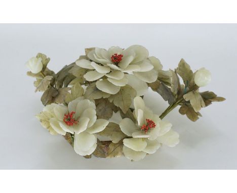 A large Chinese white jade floral arrangement of peony,with leaves of green jade with buds of corral Diameter 35cm