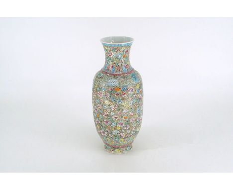 A Chinese porcelain Roleau form vase painted in colored enamel with mille flouri patternBase bearing a red seal mark of Junre