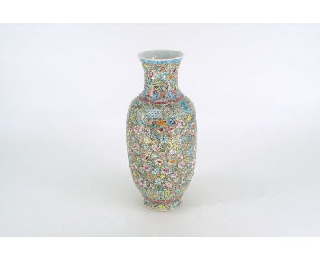 A Chinese porcelain Roleau form vase painted in colored enamel with mille flouri patternBase bearing a red seal mark of Junre