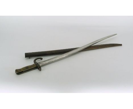 A WWI bayonet with scabbard with brass handgrip.Marked AB56102Length 27 1/2" (69 cm)