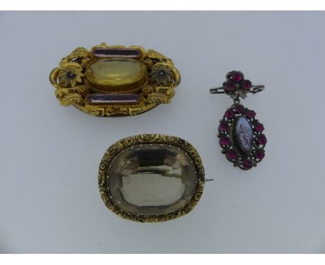 A Brooch, formed of an oval drop with enamel centre of a man playing a flute, surrounded by pink pastes, together with an ova