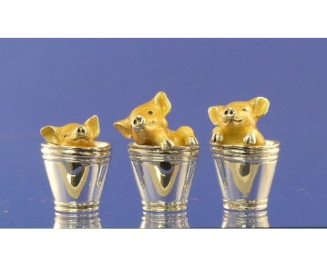 A set three Saturno contemporary silver and enamel Piglets in a Bucket, hallmarked London, 2009, makers mark JAH, tallest 3.8