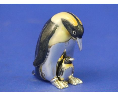 A Saturno contemporary sterling silver and enamel Penguin with Chick, hallmarked London 2009, 5.2cm high.