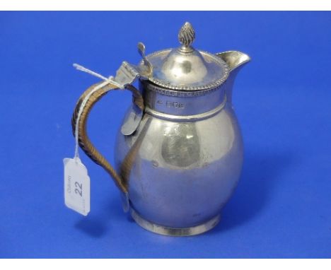 A George V silver hot milk Jug, by Harrison Brothers &amp; Howson, hallmarked 1913, of plain circular form with hinged lid an