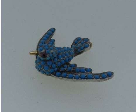 An attractive turquoise Pendant, of a swallow in flight, pave set body with amethyst eyes, mounted in yellow and white metal,
