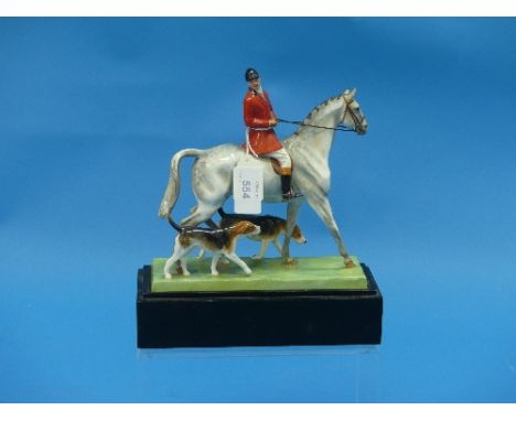 A Royal Worcester "Huntsman &amp; Hounds" group, modelled by Doris Lindner, model number 3115, puce printed and script marks,