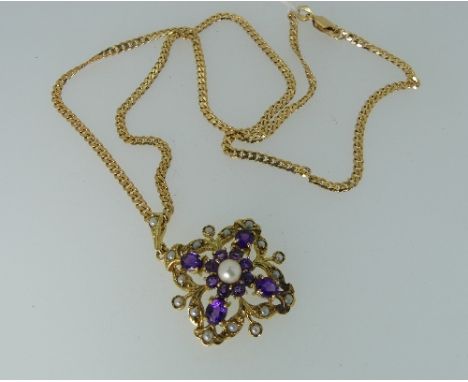 An attractive Edwardian style Pendant and Chain, the openwork pendant with central cross motif set with amethysts and central